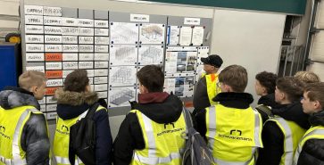 Hosting ninth-grade students and guiding them through the production facility.