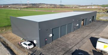 Lagerhalle X® für Simark GmbH in Hürm mit Pultdach und drei Einheiten