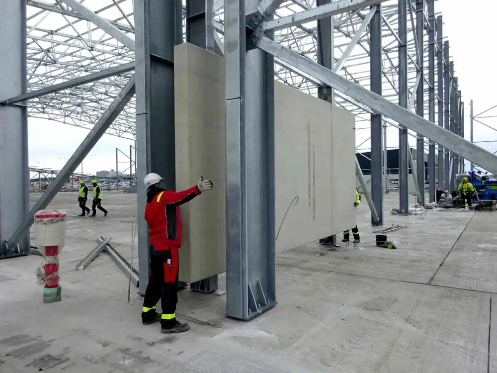 Installation of a concrete fire-wall block inside a building